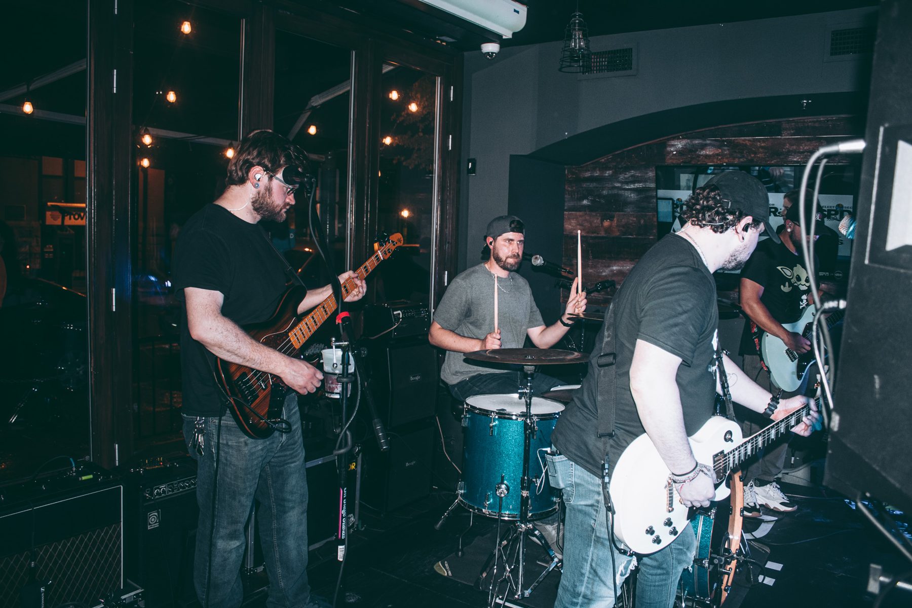 Bassist and drummer performing live