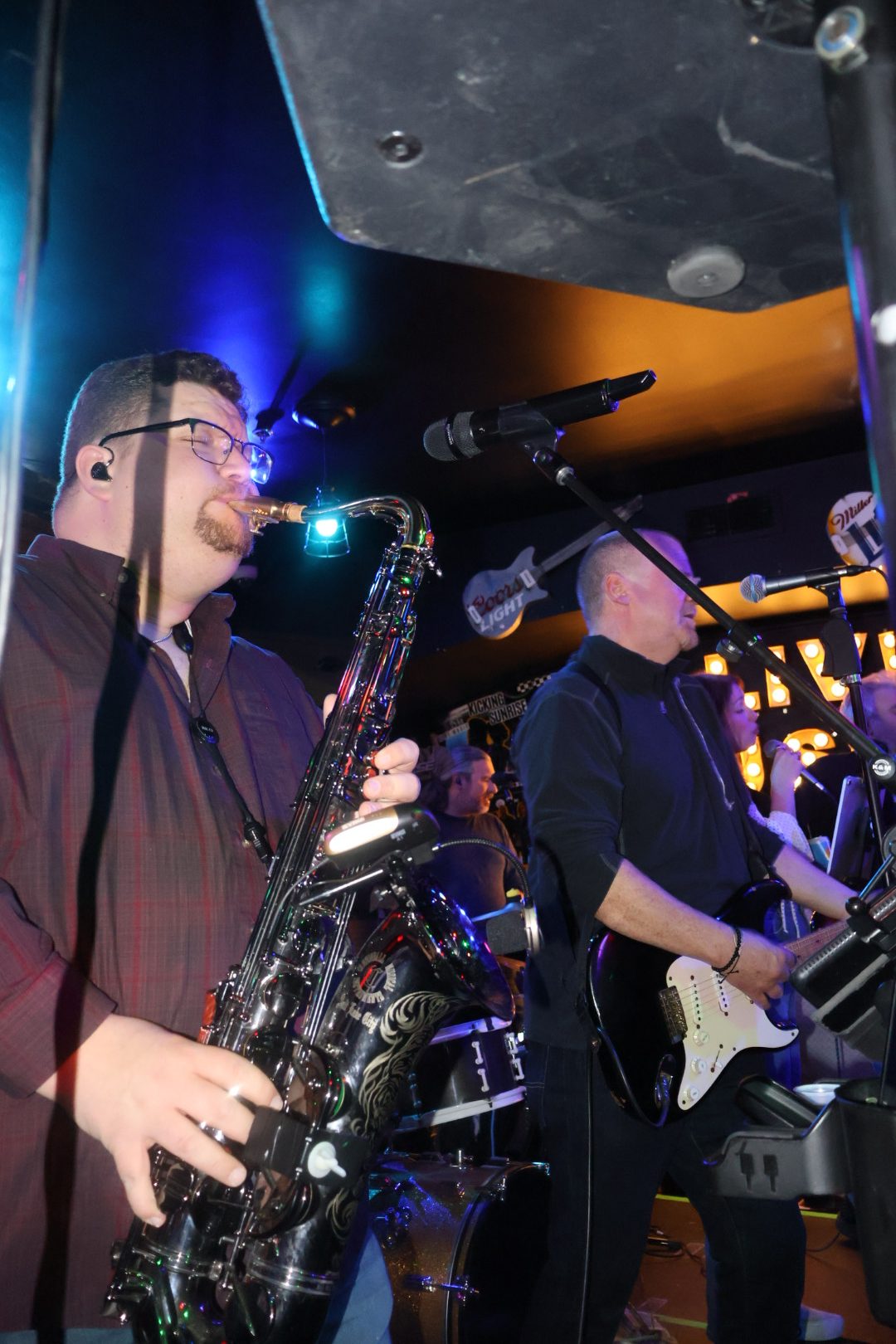 Saxophone player performing with the band