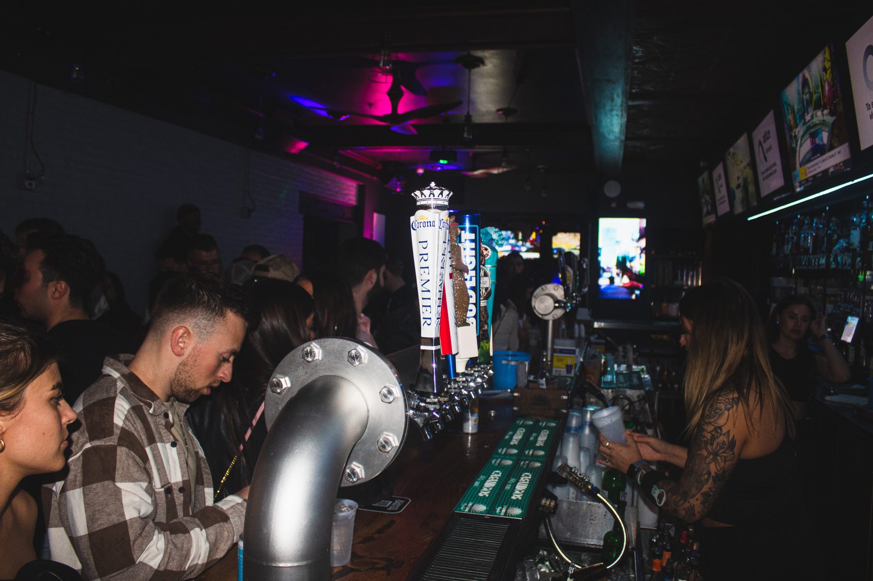 Bar taps and crowd at River Street Garage