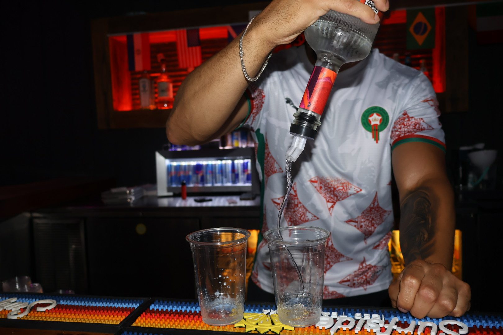 Bartender pouring a drink at River Street Garage