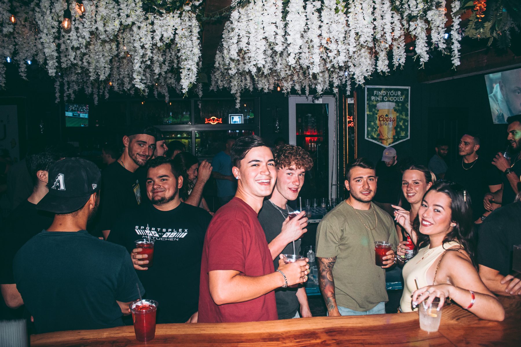 Friends dressed up and dancing at River Street Garage