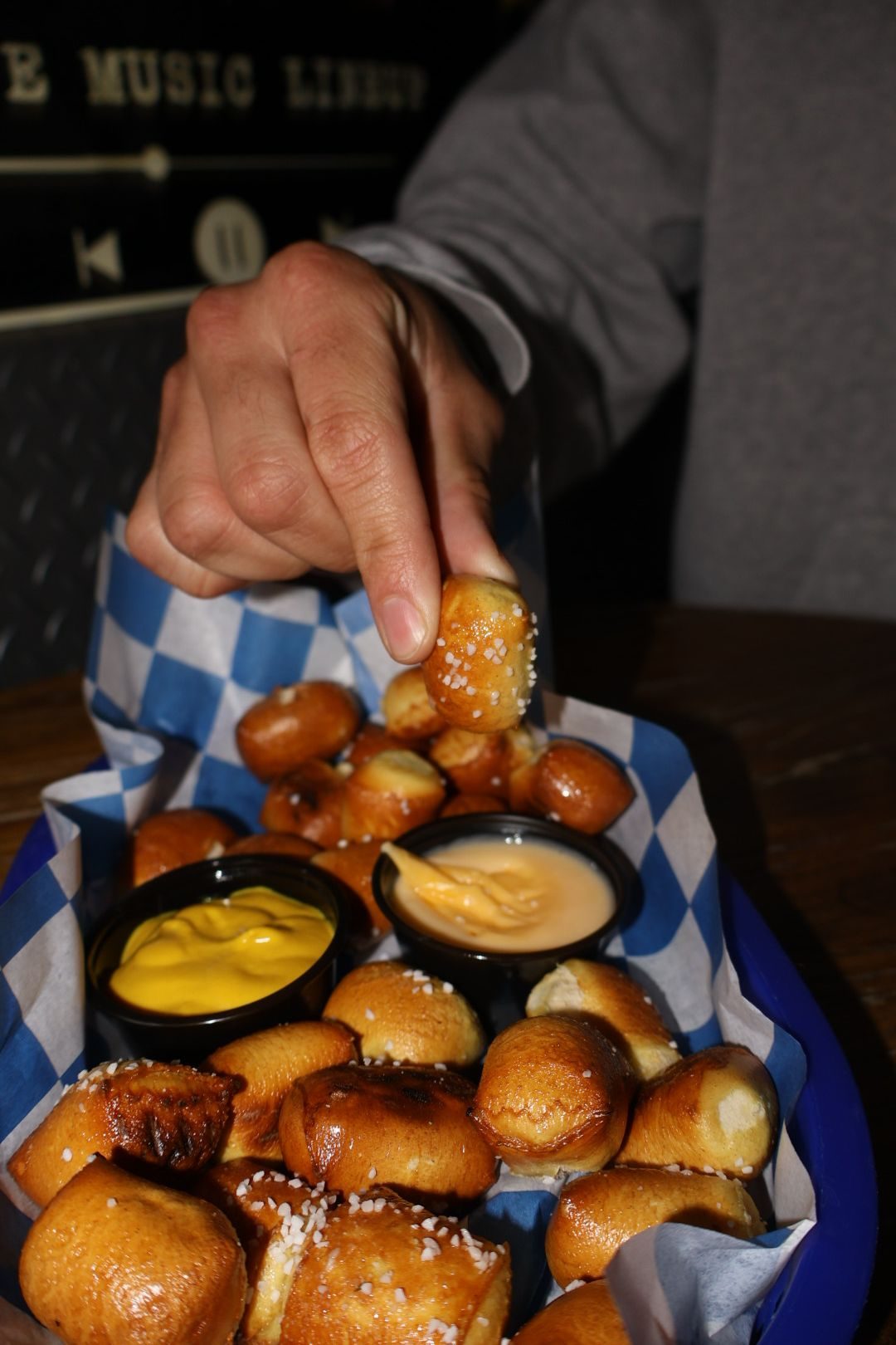 Pretzel bites with mustard and cheese dip